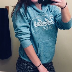 A light blue Cabelas sweatshirt